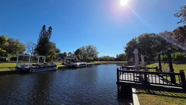 a view of a lake with boats and trees
