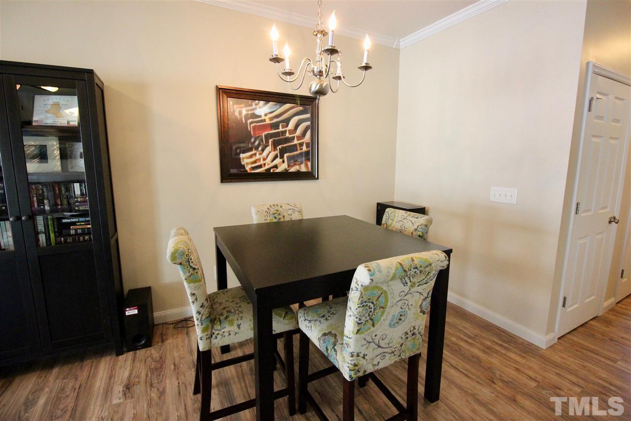 5059 Sandy Banks Road Raleigh, NC 27616 - Photo 11 of 25 The dining room is open to the living room, providing lots of room for a large gathering of family and friends.