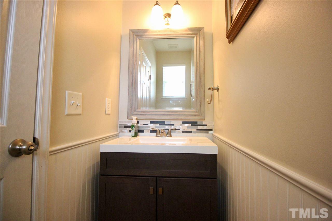 5059 Sandy Banks Road Raleigh, NC 27616 - Photo 12 of 25 The half bath is nicely updated and features a ceramic tile floor and beadboard on the walls.