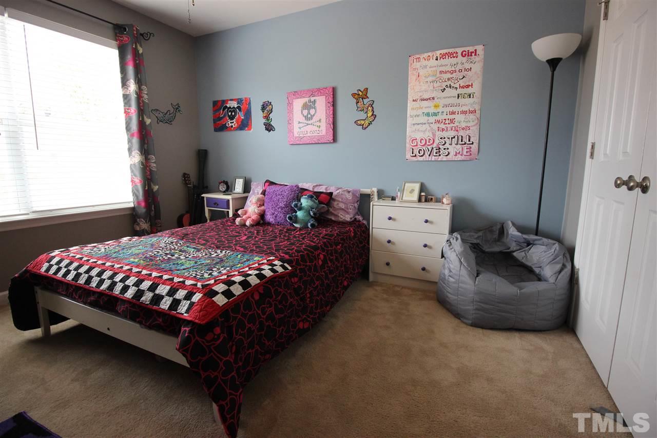 5059 Sandy Banks Road Raleigh, NC 27616 - Photo 14 of 25 The second bedroom is very generous and has lots of room for furniture and even a desk.