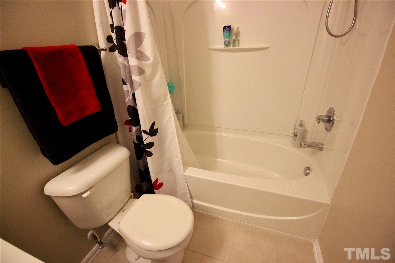 5059 Sandy Banks Road Raleigh, NC 27616 - Photo 15 of 25 The full bathroom is nicely equipped with a ceramic tile floor and a fiberglass tub/shower.