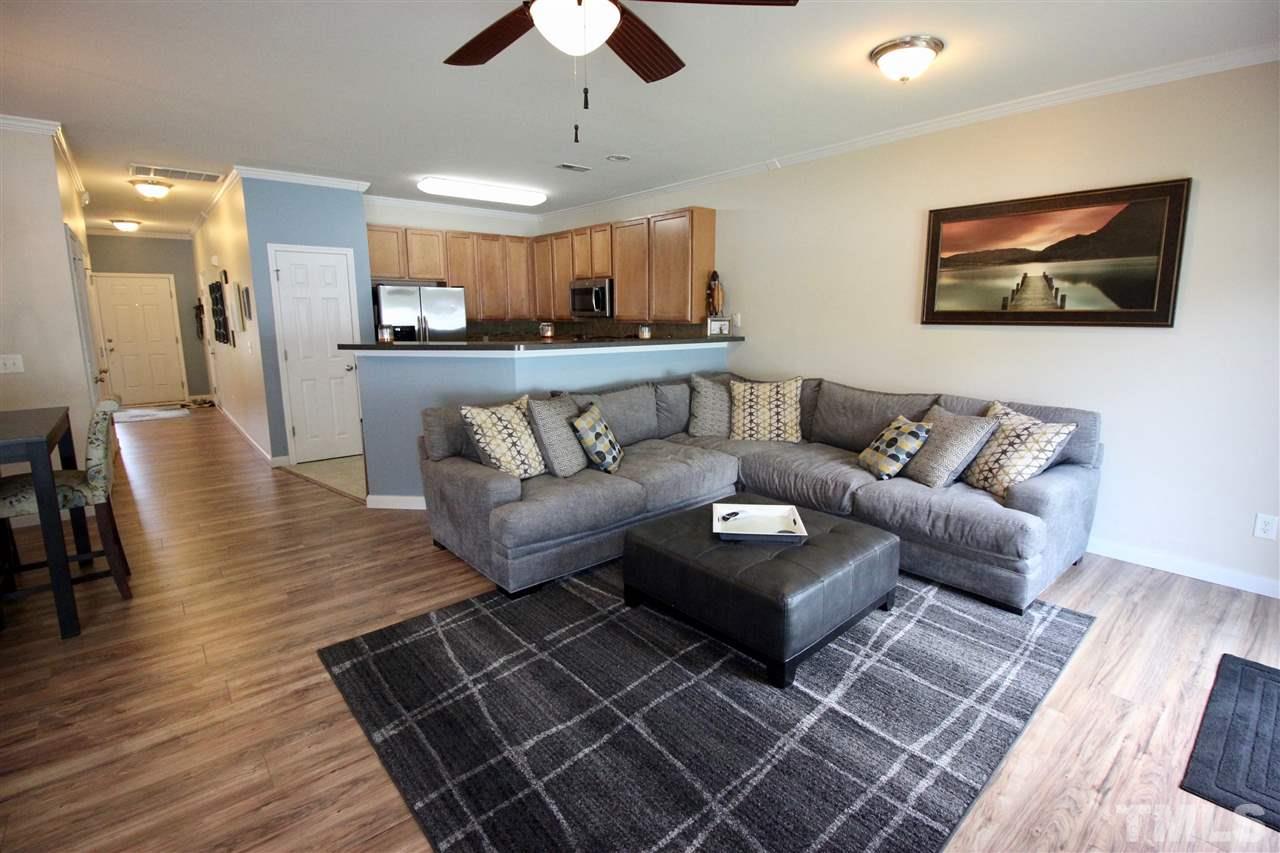 5059 Sandy Banks Road Raleigh, NC 27616 - Photo 5 of 25 Six foot extension on both floors provides for an enormous living room, open to both the kitchen and dining room.