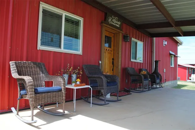 a outdoor space with patio couches and potted plants