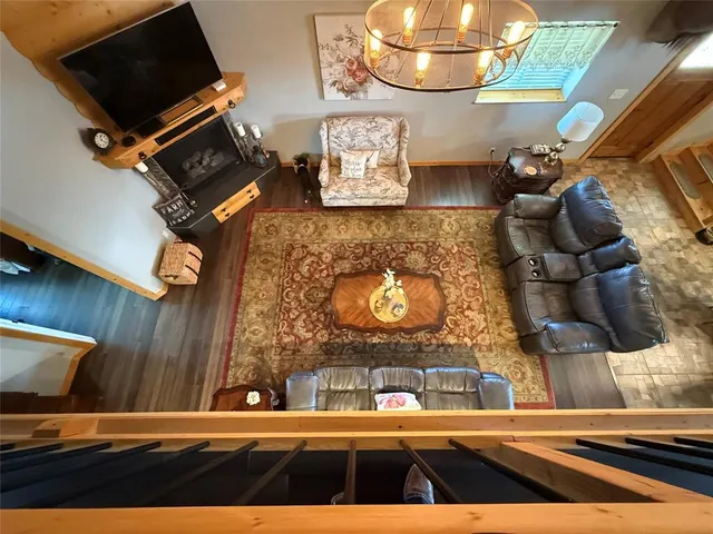 a view of a patio with table and chairs with wooden floor and fence