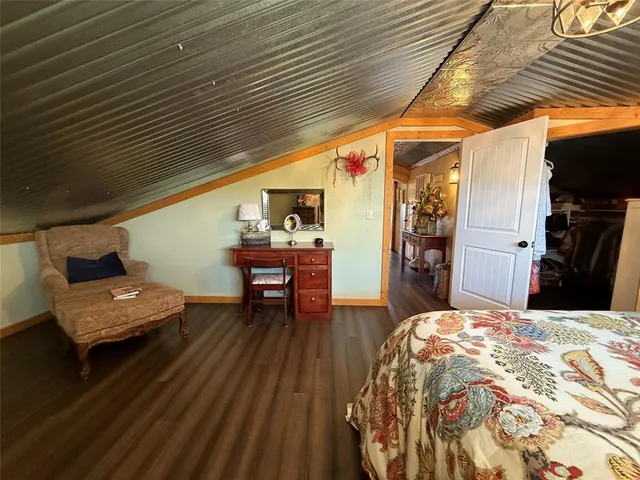 a bathroom with a bathtub sink and mirror