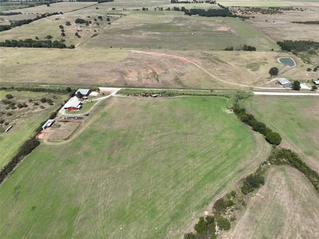 a house view with swimming pool in front of it