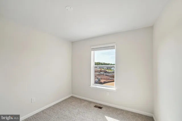 a view of a room with a hallway
