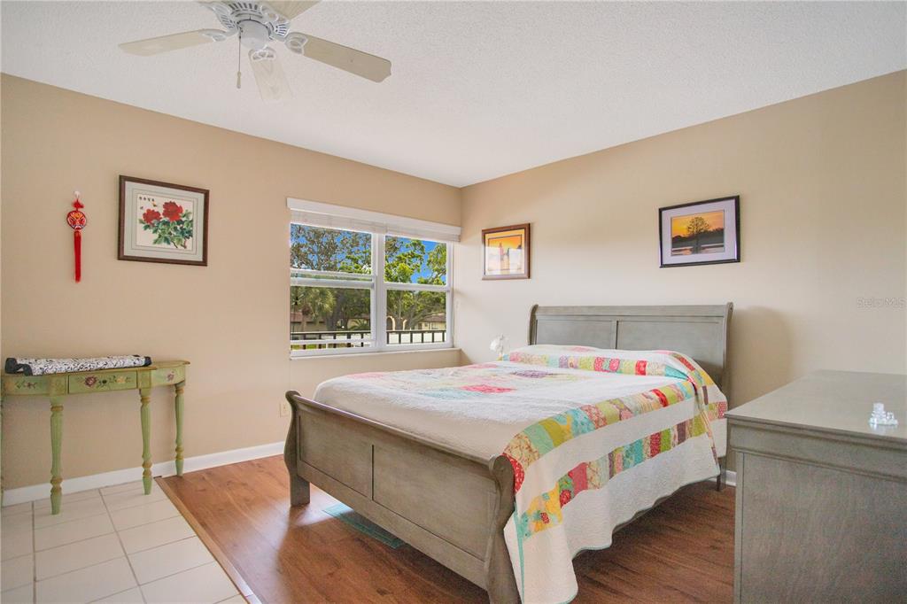 12200 Vonn Road, Unit 1209 Largo, FL 33774 - Photo 11 of 18 a bedroom with a bed and a table