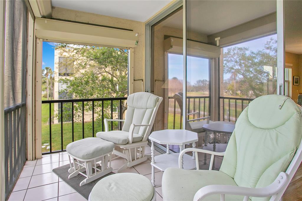 12200 Vonn Road, Unit 1209 Largo, FL 33774 - Photo 13 of 18 a living room with furniture and a large window