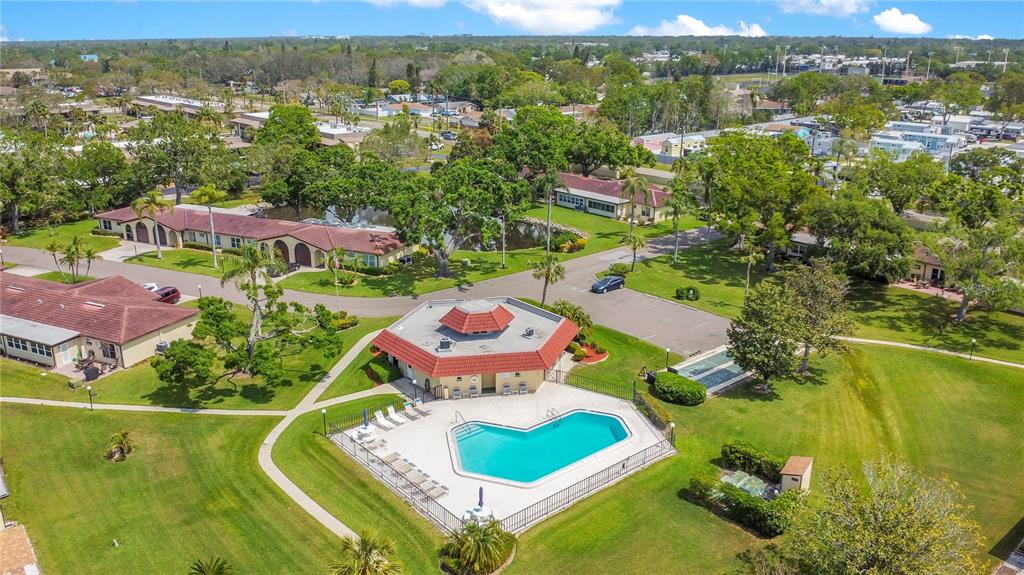 12200 Vonn Road, Unit 1209 Largo, FL 33774 - Photo 16 of 18 an aerial view of residential houses with outdoor space and swimming pool