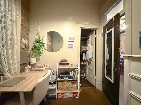 a bed sitting in a bedroom next to a window