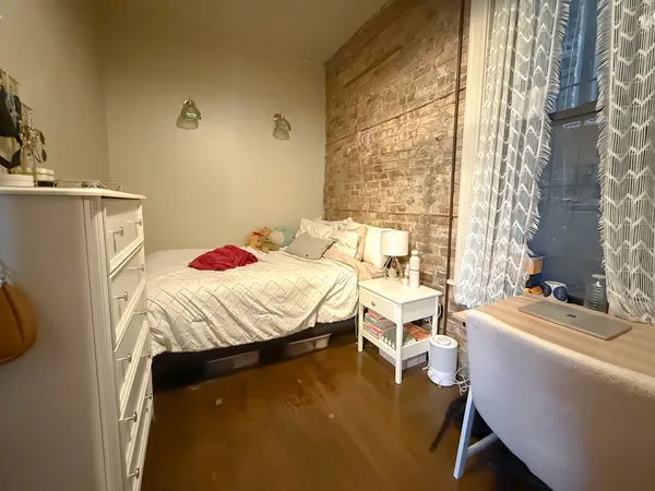 a bathroom with a toilet and a mirror