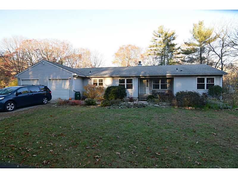 Exterior Front. 9 acres with gardens galore and koi fish pond and private deck.