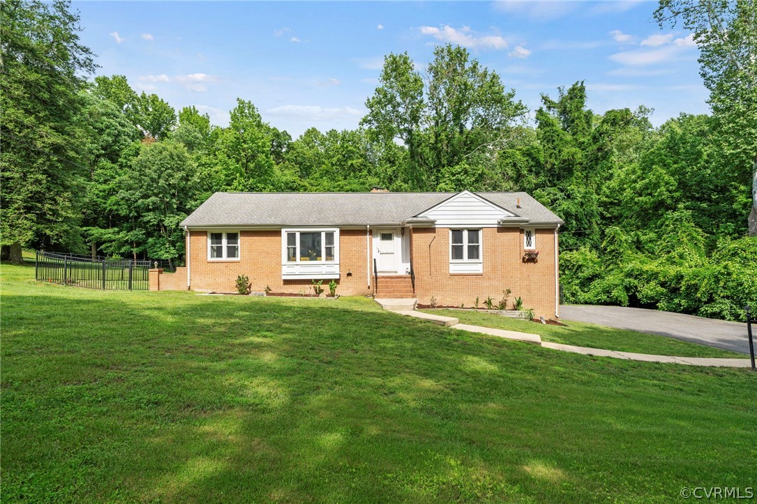 4001 Croatan Road Richmond, VA 23235 - Photo 1 of 25 a front view of a house with a yard