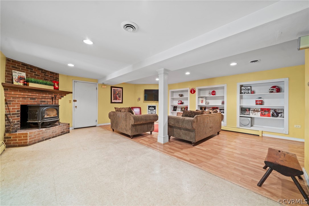 4001 Croatan Road Richmond, VA 23235 - Photo 18 of 25 a living room with furniture and a fireplace