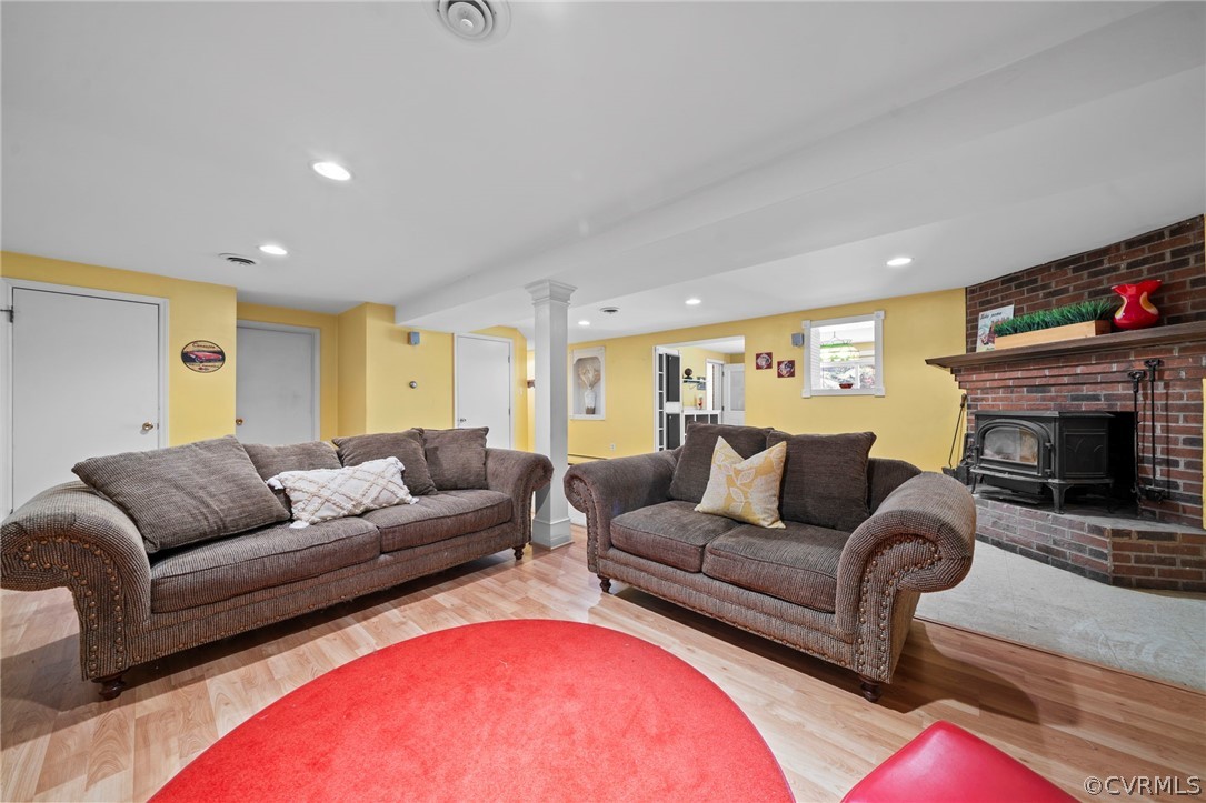 4001 Croatan Road Richmond, VA 23235 - Photo 19 of 25 a living room with furniture a fireplace and a flat screen tv