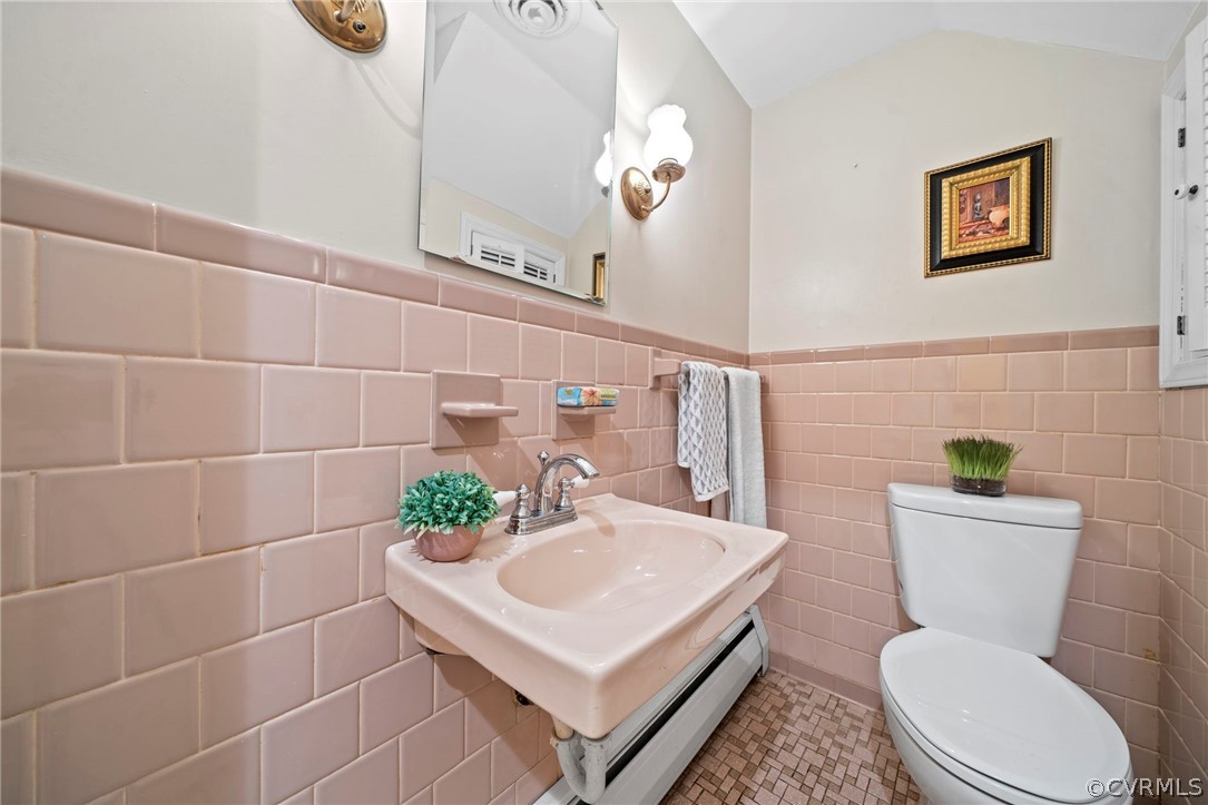4001 Croatan Road Richmond, VA 23235 - Photo 20 of 25 a white toilet sitting next to a bathroom sink