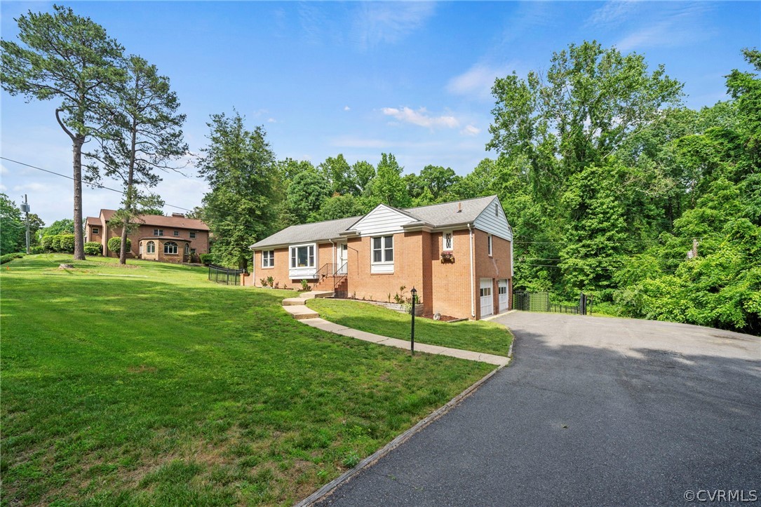 4001 Croatan Road Richmond, VA 23235 - Photo 2 of 25 a front view of a house with garden