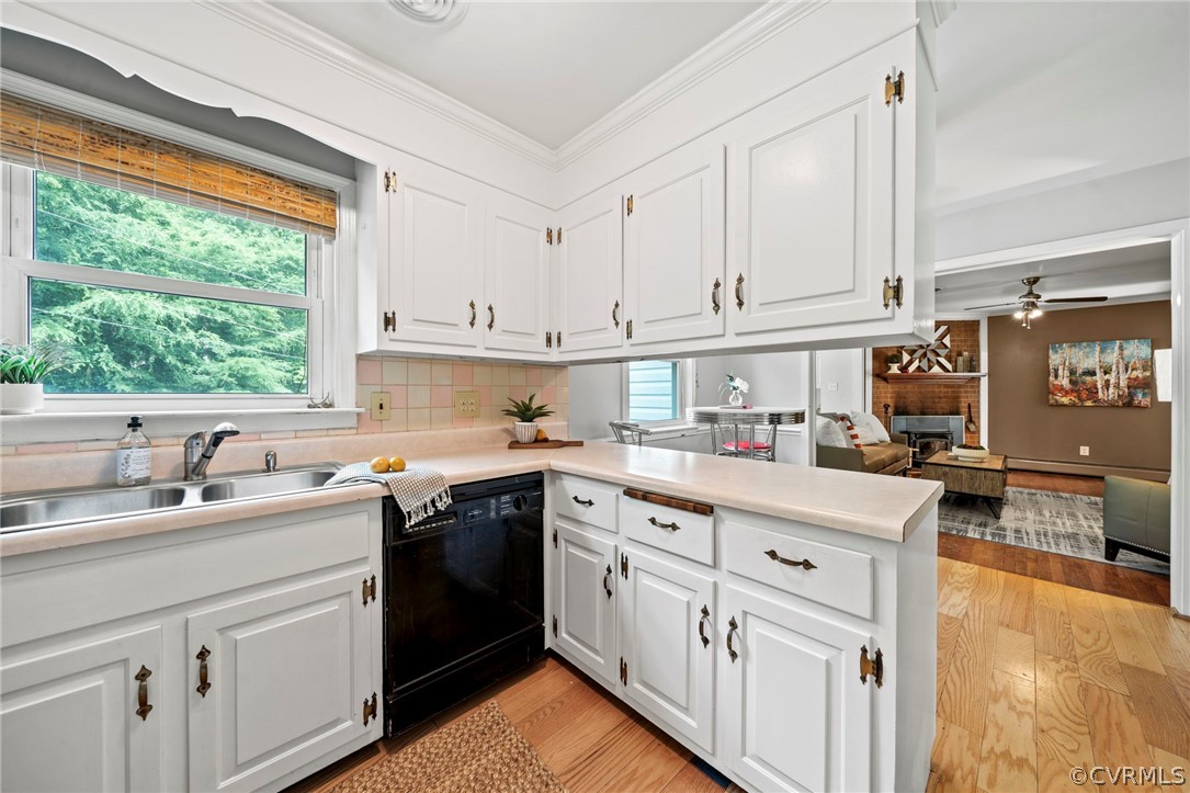 4001 Croatan Road Richmond, VA 23235 - Photo 8 of 25 a kitchen with a sink stove and cabinets