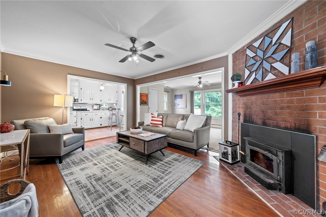 4001 Croatan Road Richmond, VA 23235 - Photo 10 of 25 a living room with furniture fireplace and a window