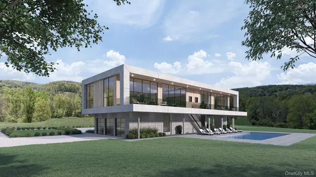 a front view of a house with a yard table and chairs