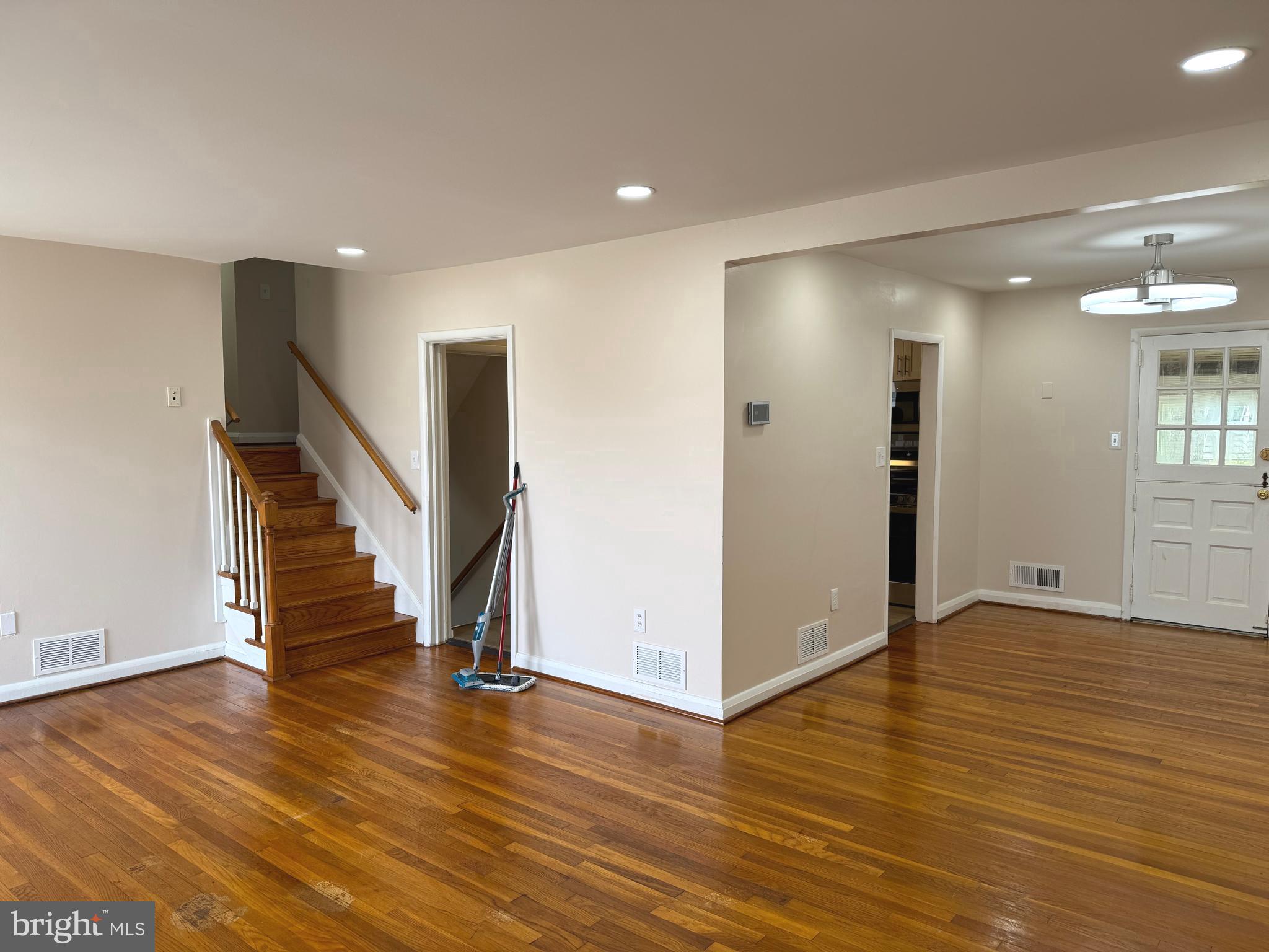 609 Wallerson Road Baltimore, MD 21228 - Photo 11 of 15 a view of entryway with wooden floor and stairs