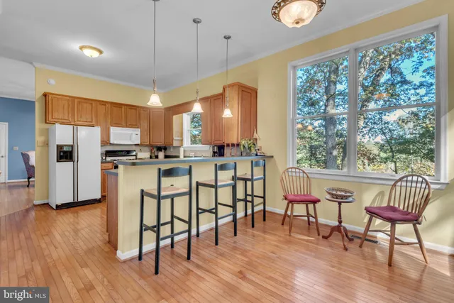 a living room with furniture fireplace and window
