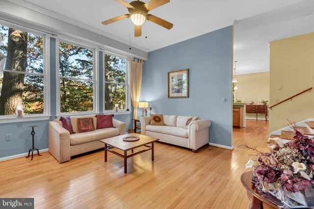 an empty room with closet and a ceiling fan