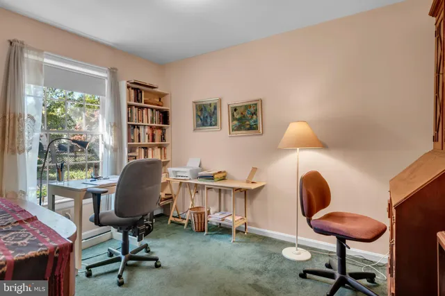 a bathroom with a sink toilet and a mirror