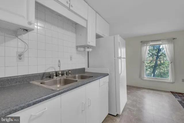 a bathroom with a shower and a curtain