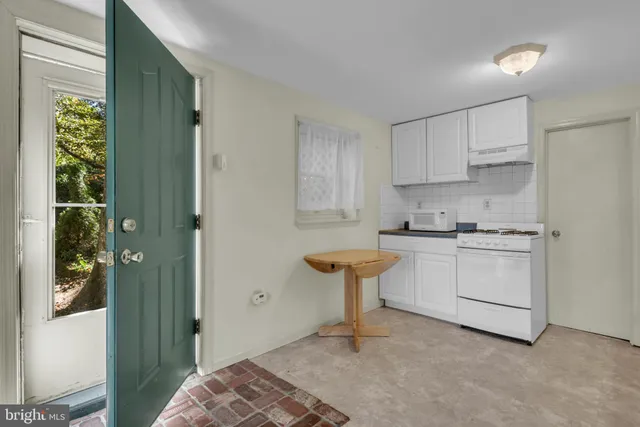 a view of a deck with a small yard