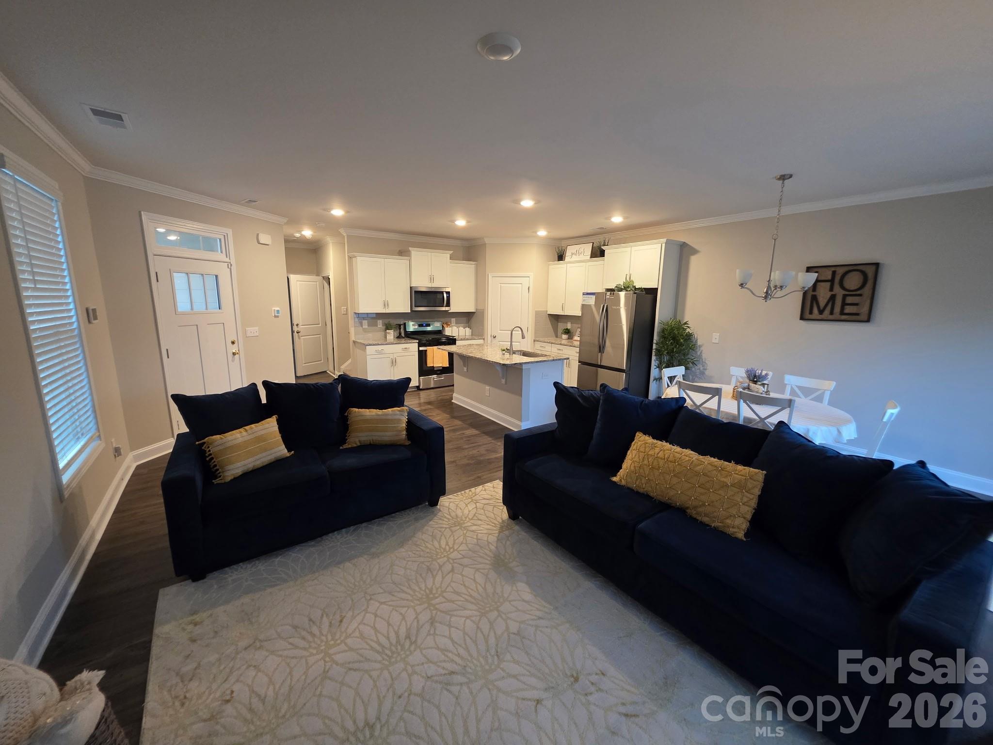 592 Altamonte Drive Clover, SC 29710 - Photo 4 of 22 a living room with furniture a rug and kitchen view