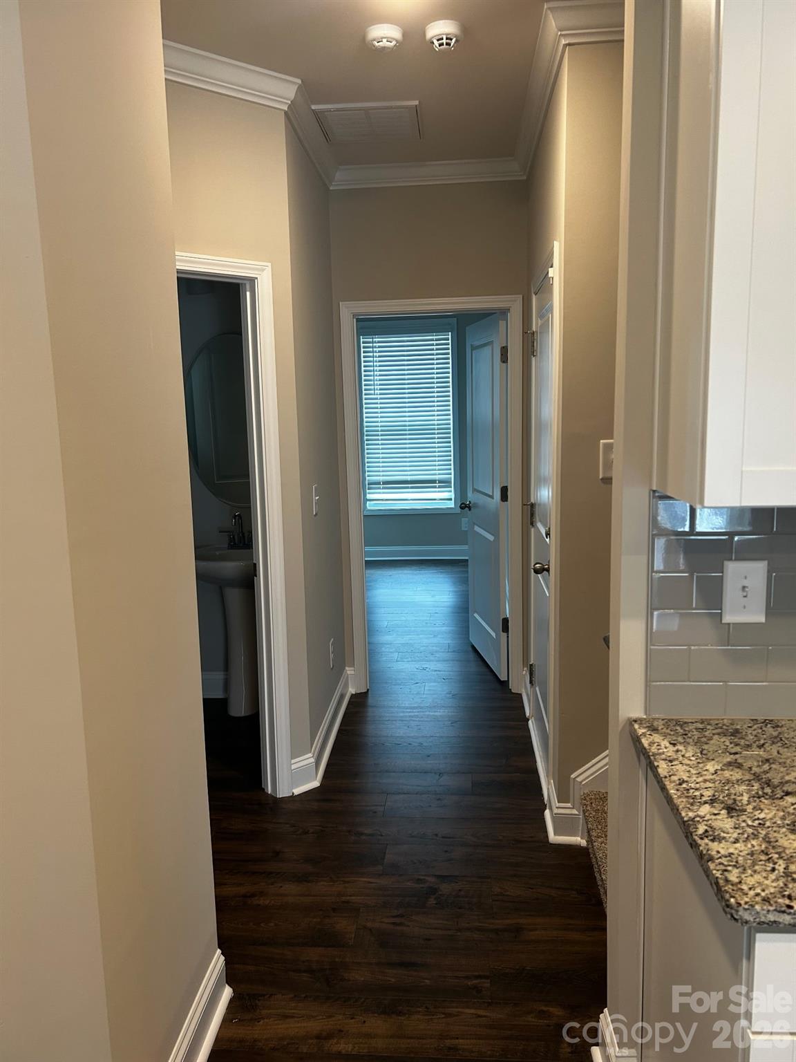 592 Altamonte Drive Clover, SC 29710 - Photo 7 of 22 a view of a hallway with wooden floor and staircase