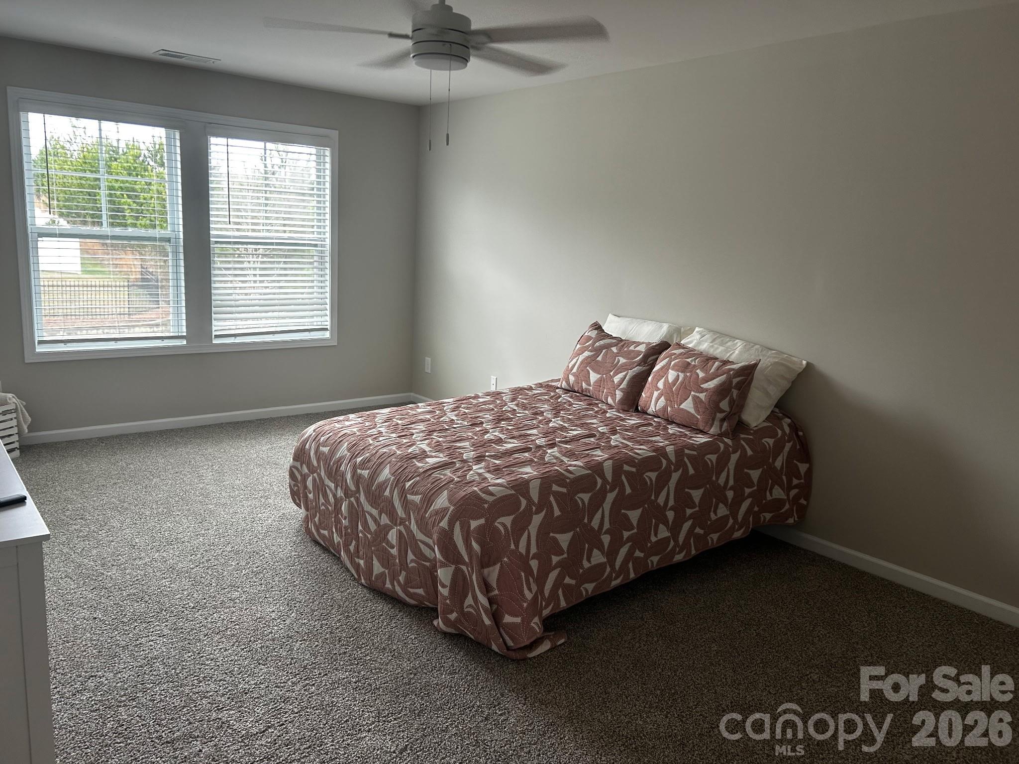 592 Altamonte Drive Clover, SC 29710 - Photo 10 of 22 a bed sitting in a bedroom next to a window