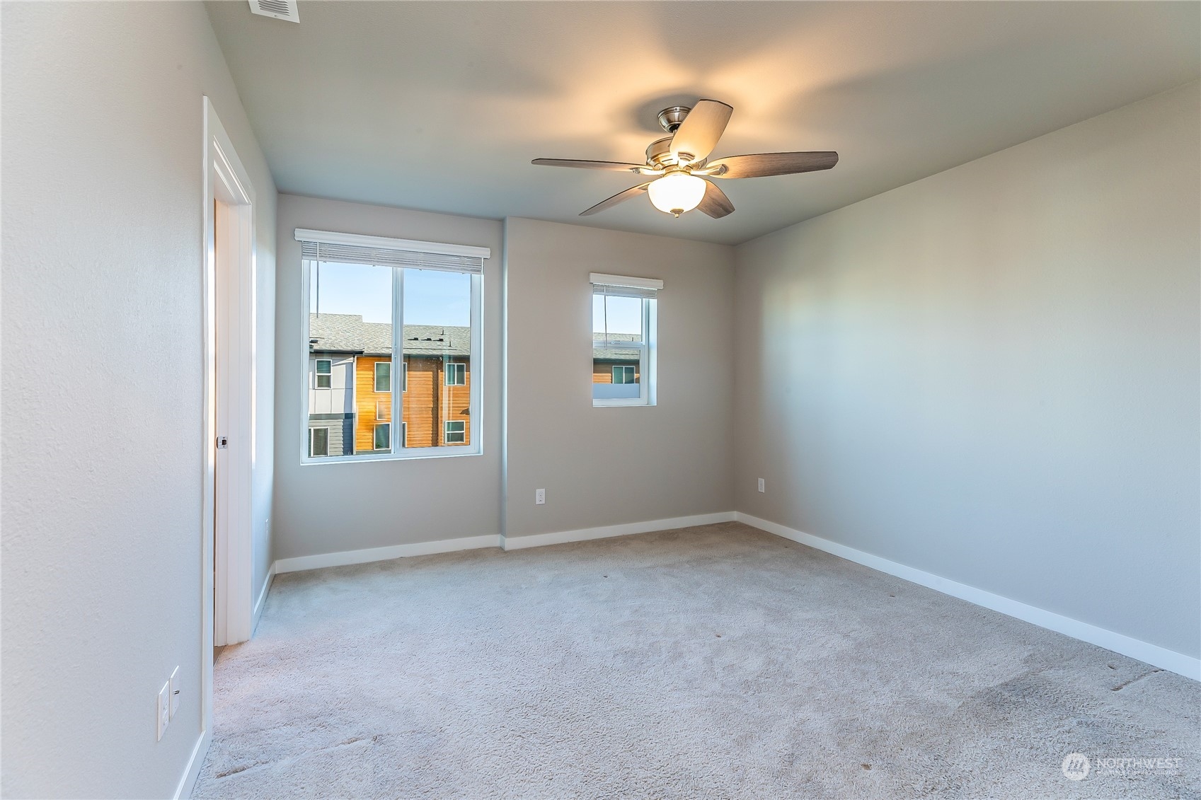 19308 35th Drive Southeast, Unit D Bothell, WA 98012 - Photo 15 of 32 a view of an empty room with a chandelier fan