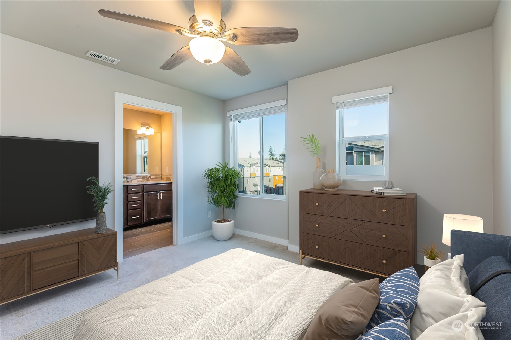 19308 35th Drive Southeast, Unit D Bothell, WA 98012 - Photo 16 of 32 a bedroom with a bed and a flat screen tv