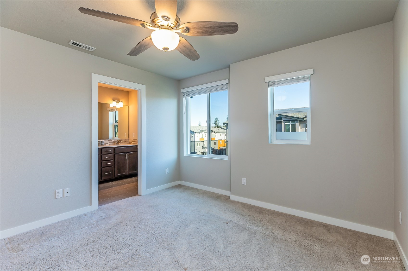19308 35th Drive Southeast, Unit D Bothell, WA 98012 - Photo 17 of 32 a view of a room with a ceiling fan and a window