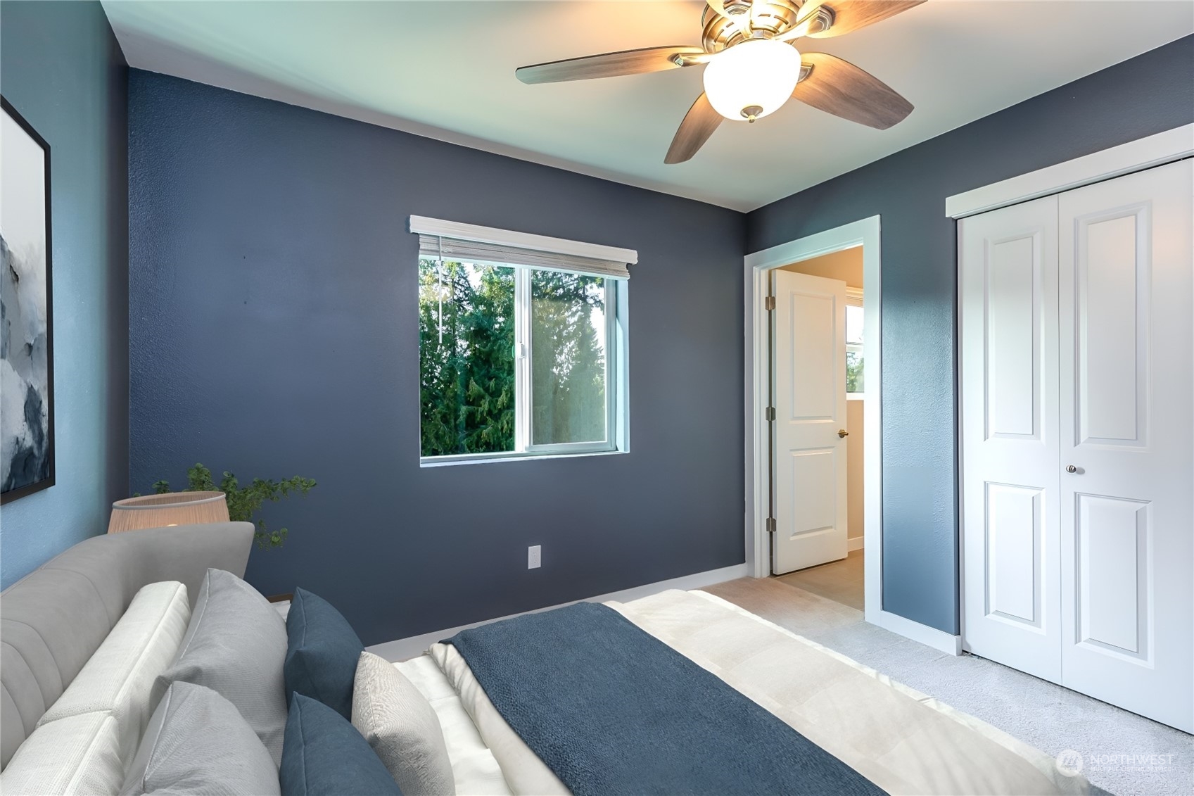 19308 35th Drive Southeast, Unit D Bothell, WA 98012 - Photo 22 of 32 a bedroom with a bed and a chandelier