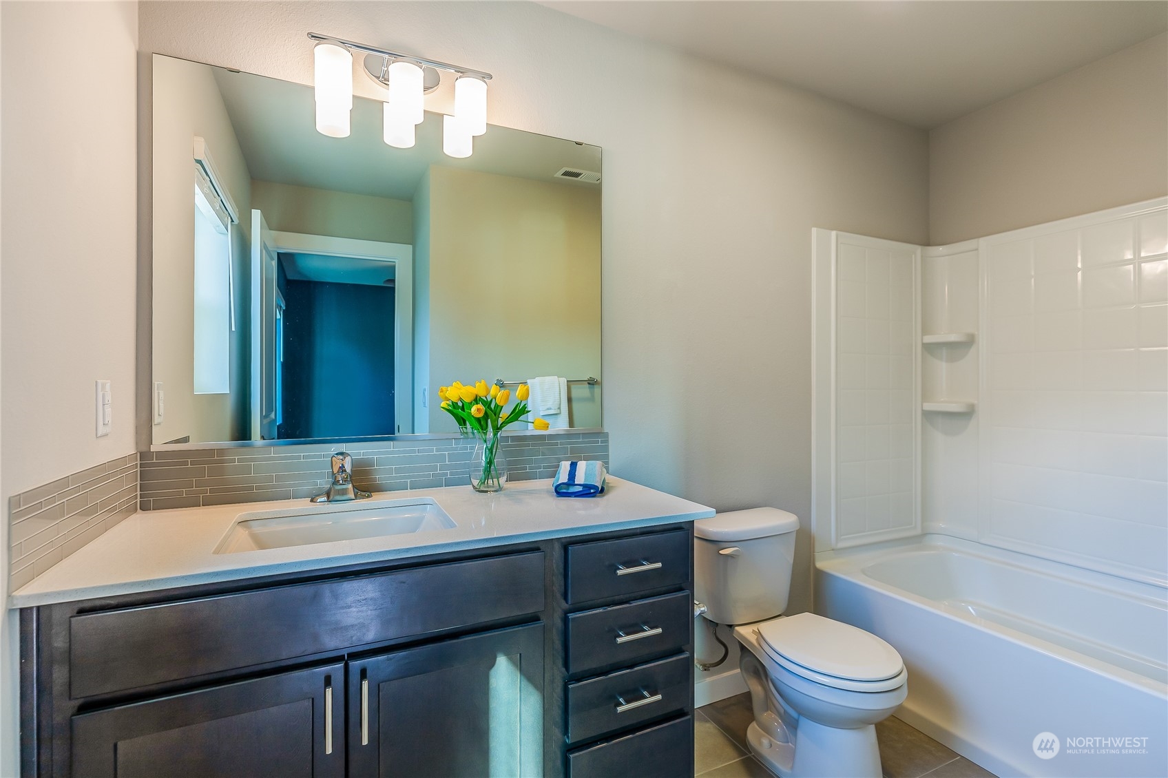 19308 35th Drive Southeast, Unit D Bothell, WA 98012 - Photo 24 of 32 a bathroom with a sink vanity mirror and toilet