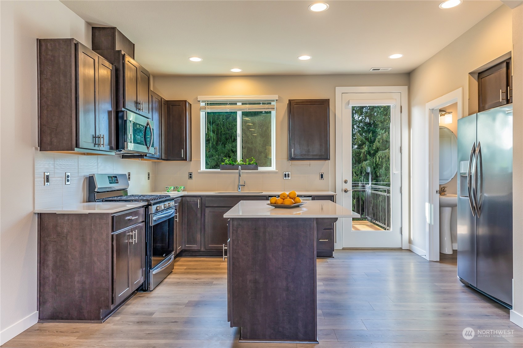 19308 35th Drive Southeast, Unit D Bothell, WA 98012 - Photo 3 of 32 a kitchen with stainless steel appliances granite countertop a refrigerator a sink dishwasher a stove and a refrigerator