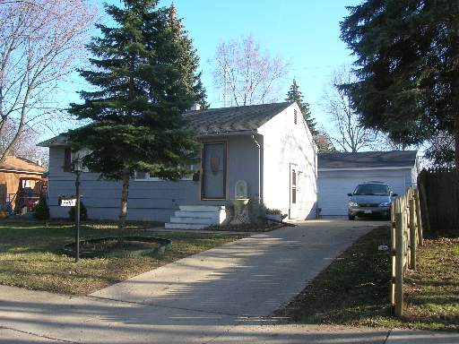 2241 West Cheyenne Road Waukegan, IL 60087 - Photo 1 of 1 a front view of a house with garden