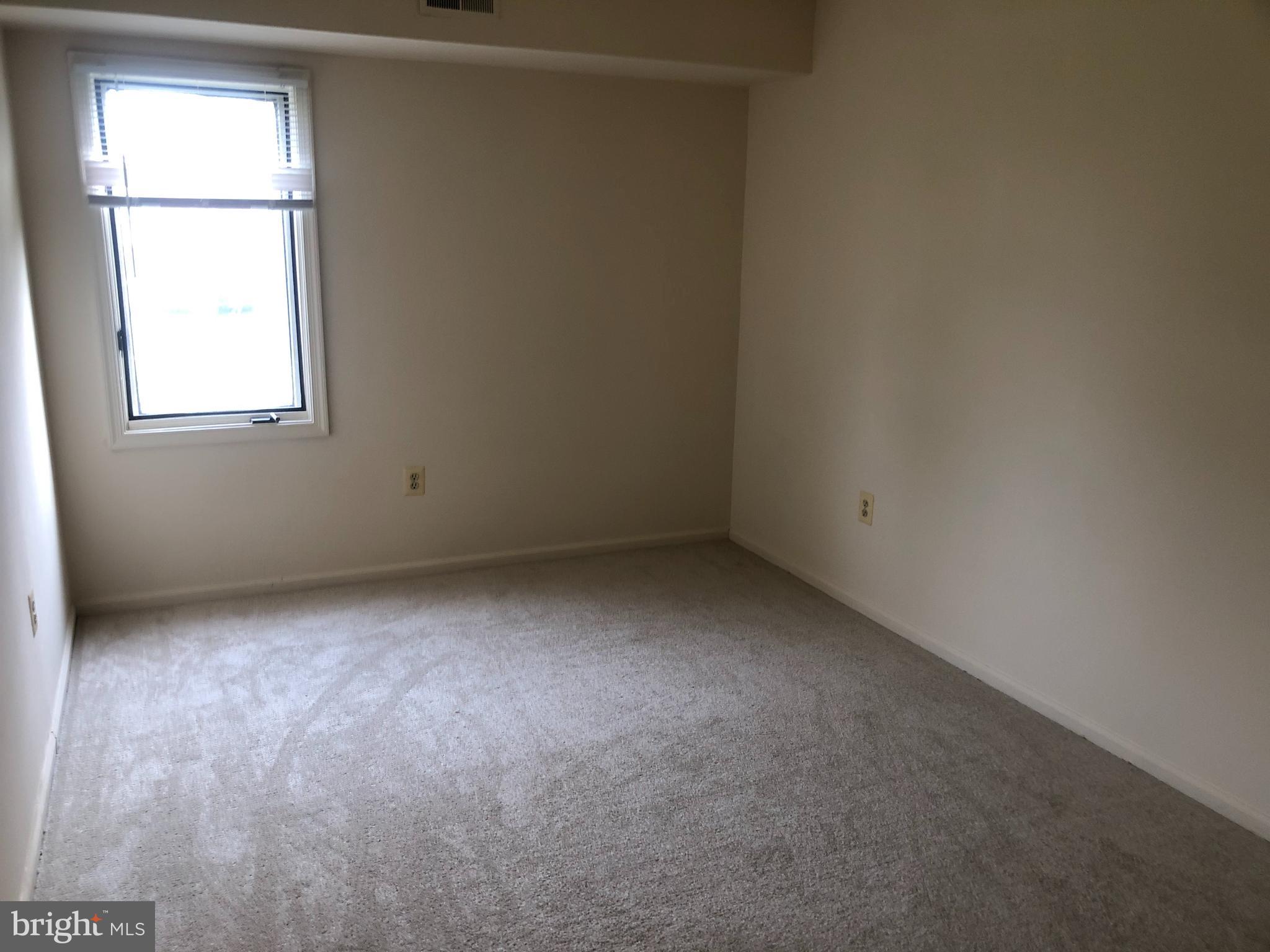 2 James Street, Unit 1B Frederick, MD 21701 - Photo 7 of 11 an empty room with a window