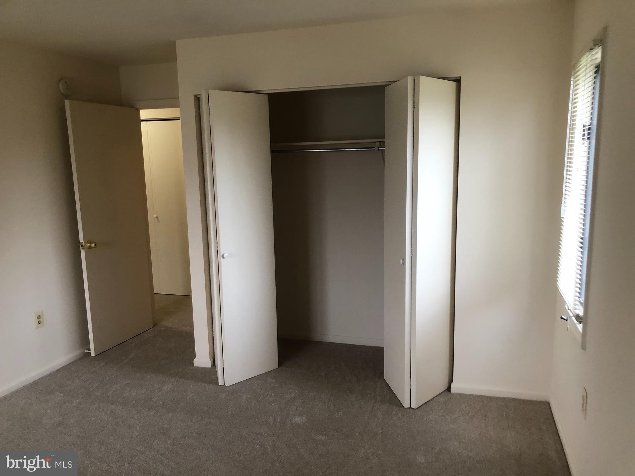 2 James Street, Unit 1B Frederick, MD 21701 - Photo 9 of 11 an empty room with windows and closet