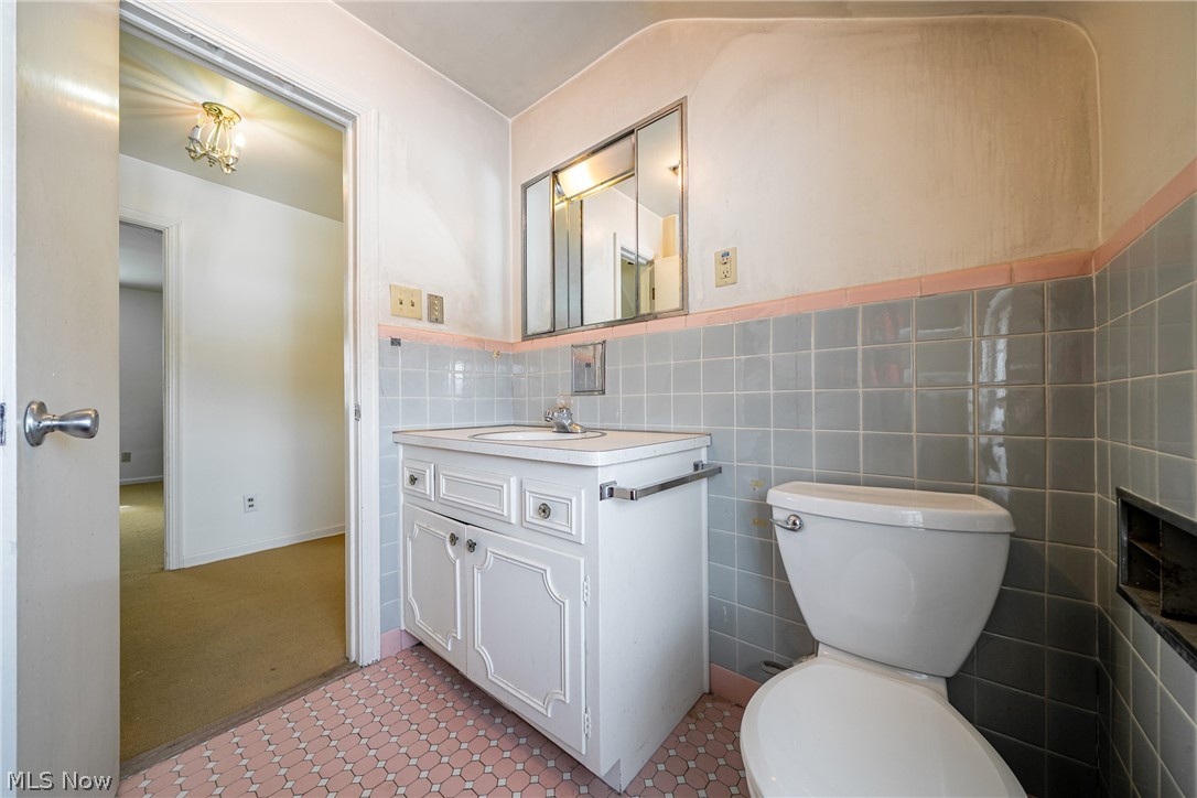4602 College Road South Euclid, OH 44121 - Photo 22 of 26 Bathroom with vanity and tile walls