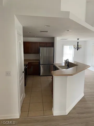 a kitchen with a sink and cabinets