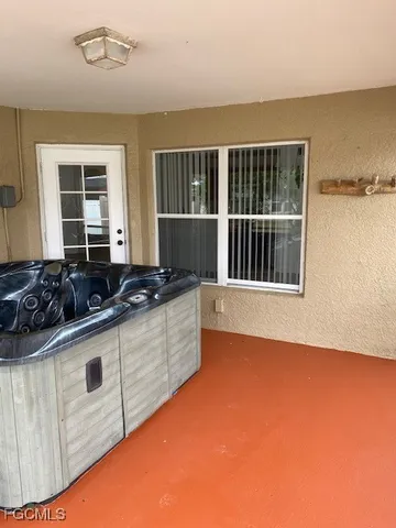 a kitchen with stainless steel appliances granite countertop a sink a stove and a granite counter top