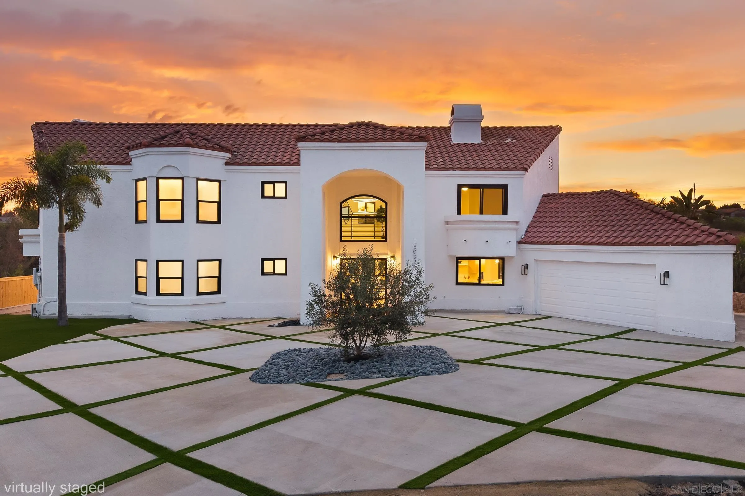 a front view of a house with large windows