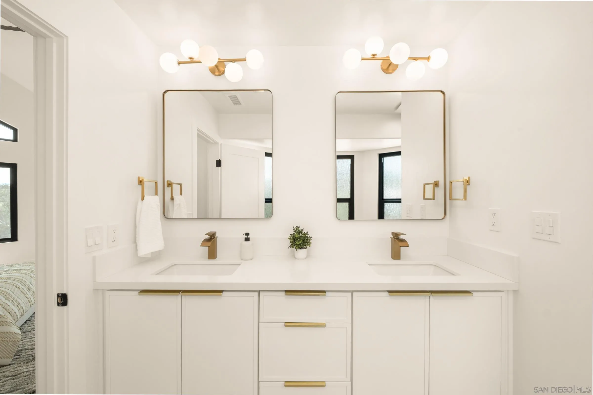 15032 Heath Drive Poway, CA 92064 - Photo 26 of 67 a bathroom with double vanity sinks and a mirror