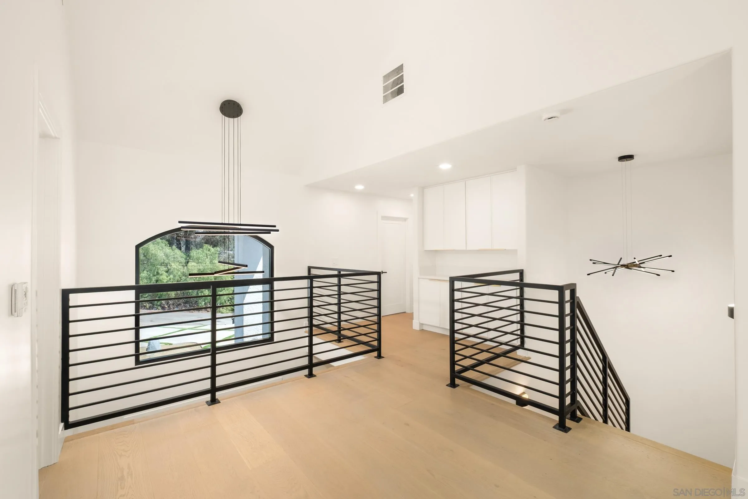 15032 Heath Drive Poway, CA 92064 - Photo 34 of 67 a view of a hallway with stairs and furniture
