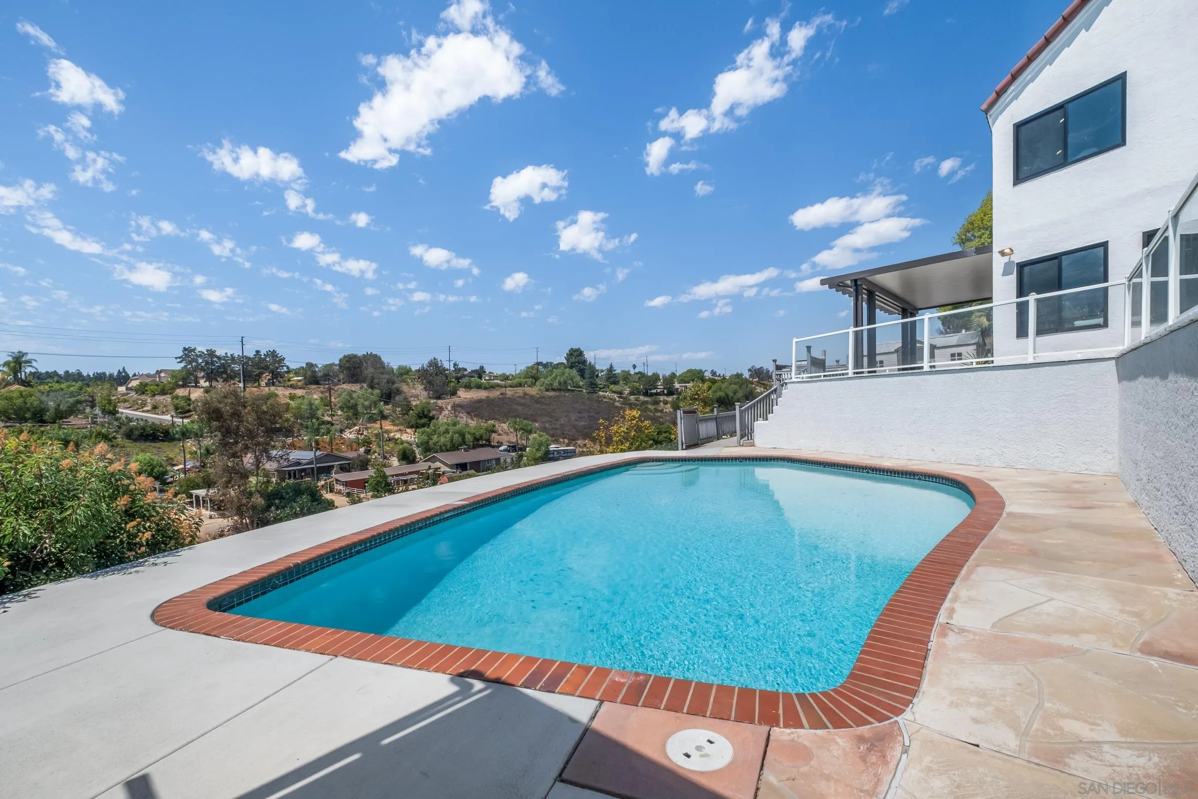15032 Heath Drive Poway, CA 92064 - Photo 53 of 67 a view of a swimming pool with a lounge chairs